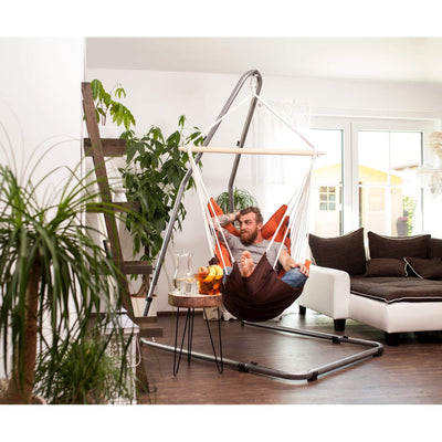 Padded hammock chair with wooden spreader bar and metal stand